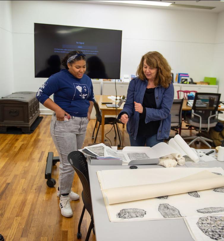 Student and Instructor discuss artistic prints