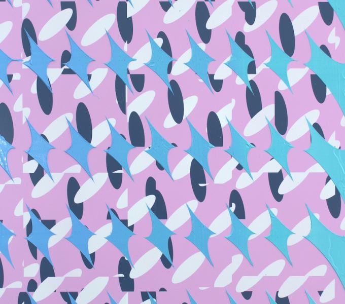 Black and white ovals and blue diamond shapes patterned over a pink background